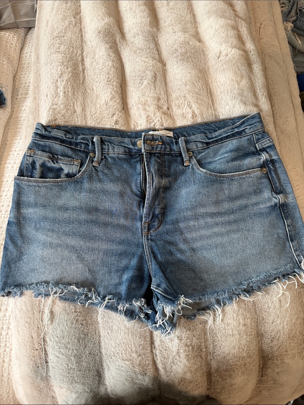 Good American Distressed Light Blue Denim Cutoff Shorts